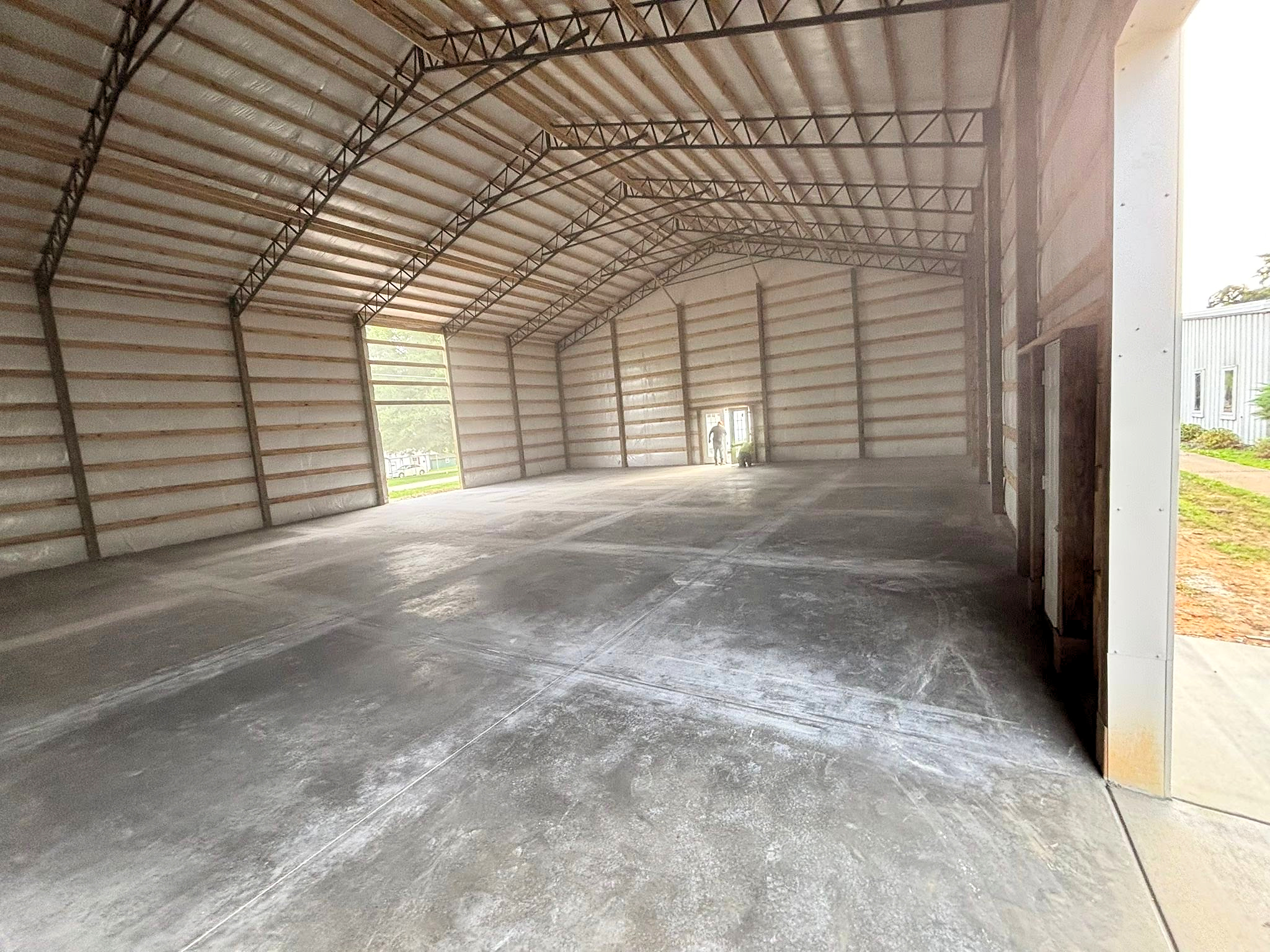 Finished concrete shop floor inside a metal building